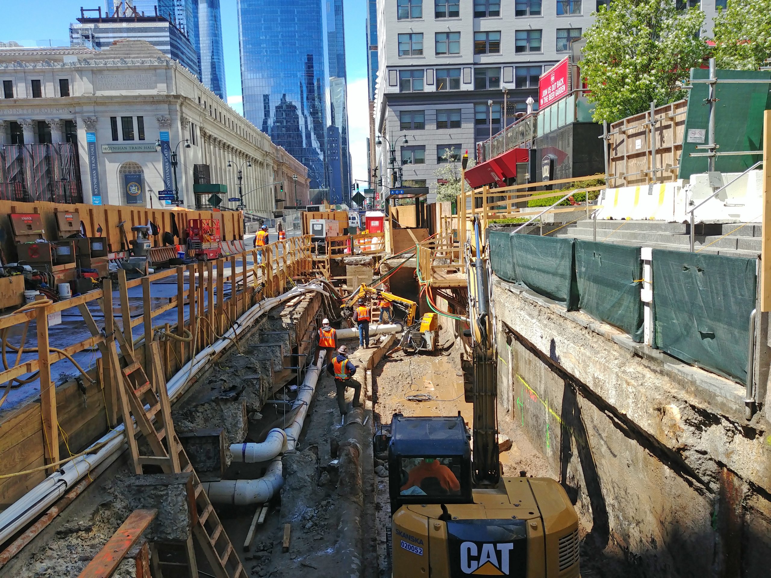 Construction workers demolishing the western utility box.